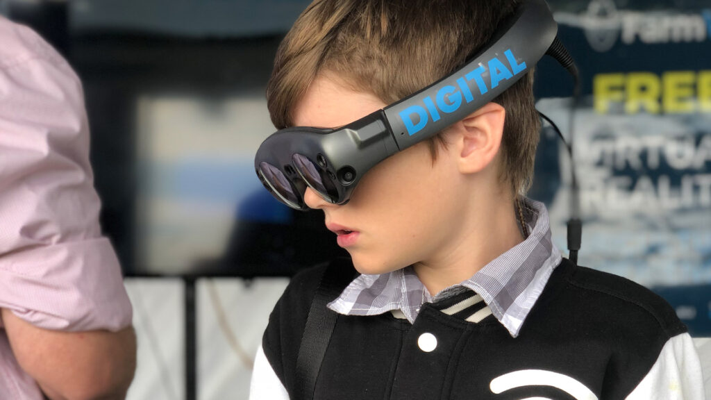 A boy wearing an AR headset.